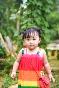 Portrait of cute girl playing in park