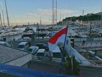 Boats in city against sky