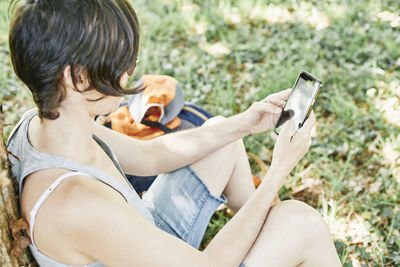 Midsection of woman using mobile phone