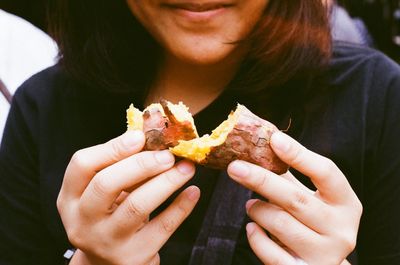 Close-up of woman eating food