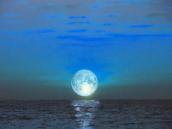 Scenic view of sea against blue sky