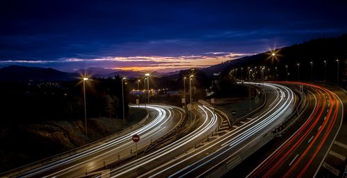 High angle view of light trails on highway at night