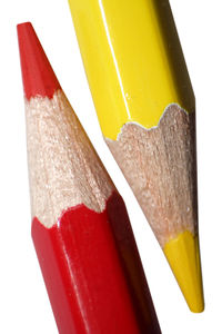 Close-up of colored object over white background