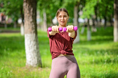 Young woman exercising in park