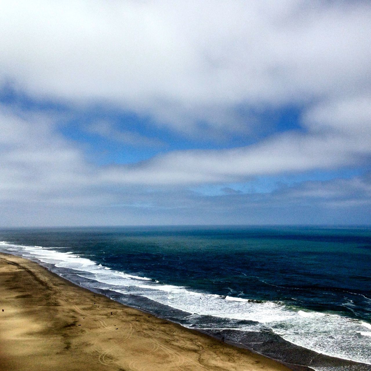 sea, beach, horizon over water, sky, water, scenics, shore, tranquil scene, tranquility, beauty in nature, cloud - sky, cloudy, nature, wave, sand, weather, idyllic, overcast, surf, cloud