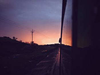 Silhouette landscape against sky during sunset