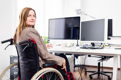 Woman sitting on table