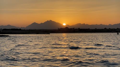 Scenic view of sea against sky during sunset