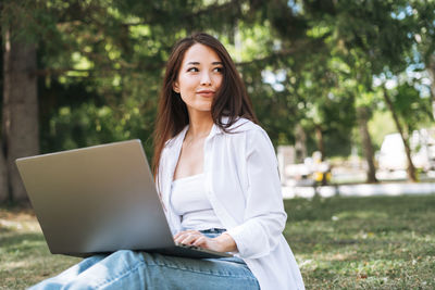 Young woman using laptop