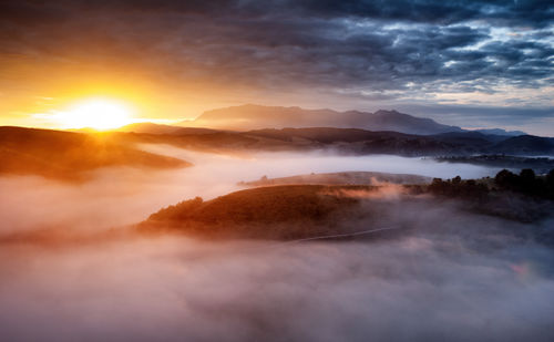 Scenic view of mountains against sky during sunset