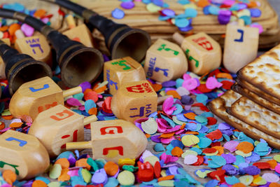 Close-up of colorful confetti on table during hanukkah