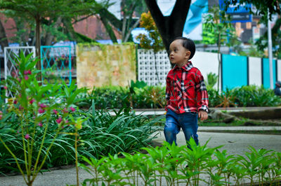 Full length portrait of smiling boy