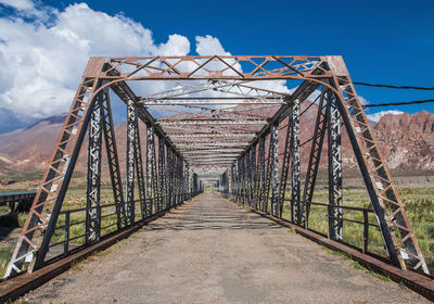 Diminishing perspective of old iron bridge, uspallata, mendoza