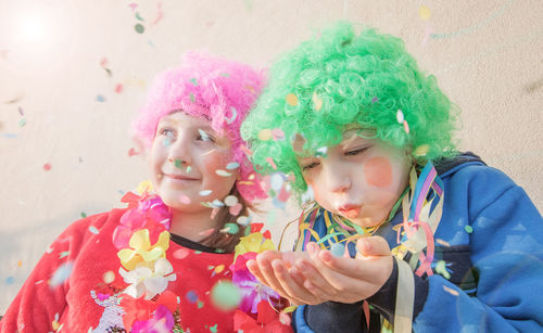 Children playing with confetti during event