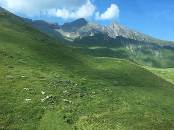 Scenic view of landscape and mountains against sky