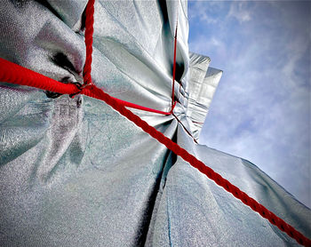 Low angle view of umbrella against sky