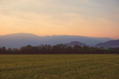 Scenic view of landscape at sunset