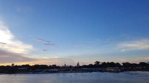 Scenic view of river against sky during sunset