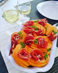 High angle view of fruits in plate on table