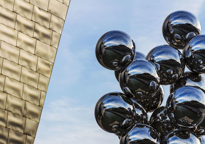 Low angle view of statue against sky