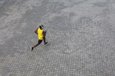 High angle view of man walking on street