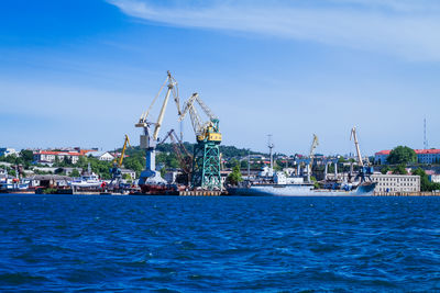 Boats in sea against sky