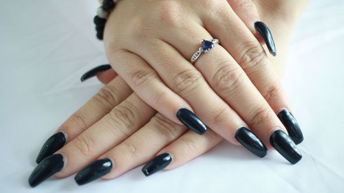 Close-up of woman hand on table