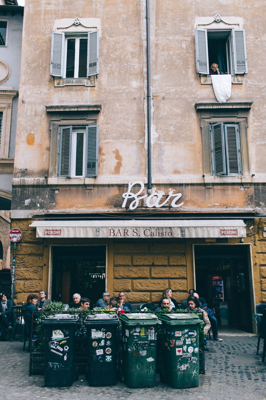 PEOPLE IN FRONT OF CITY