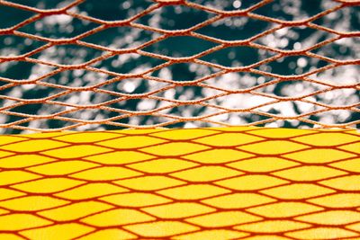 Close-up of net against sea