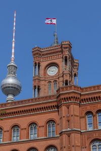 Low angle view of building against blue sky