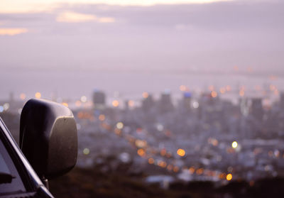 Close-up of cropped object against sky at sunset