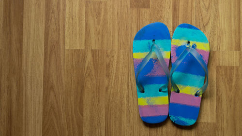 High angle view of colorful balloons on hardwood floor