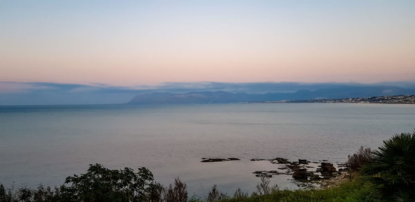 Scenic view of sea against sky during sunset