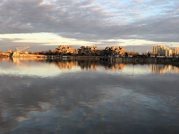 Scenic view of lake against sky during sunset