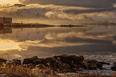 Scenic view of lake against sky during sunset