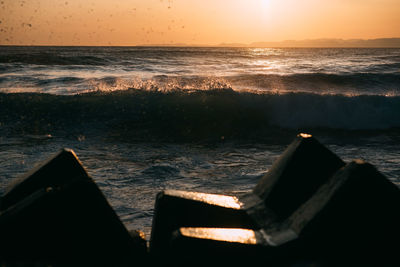 Scenic view of sea against sky during sunset