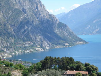 Scenic view of sea and mountains against sky