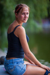 Close-up of woman sitting outdoors