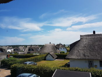 Houses and buildings against sky