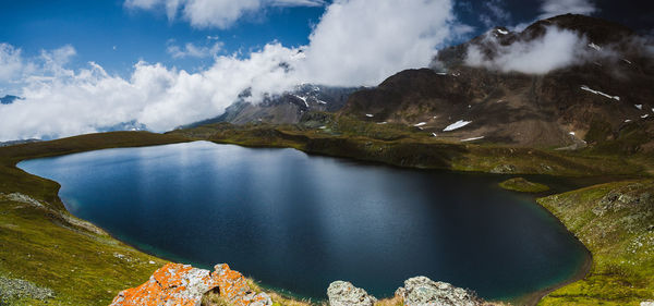 Scenic view of lake against mountains at gran paradiso national park