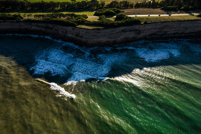 High angle view of water flowing in sea