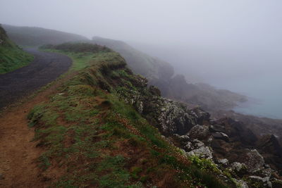 Scenic view of mountains in foggy weather