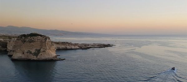 Scenic view of sea against sky during sunset