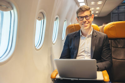 Portrait of businessman using digital tablet in office