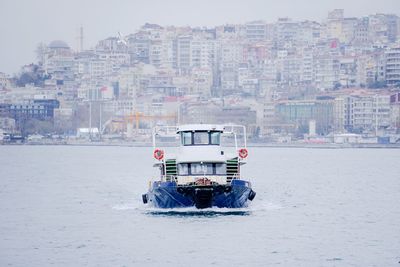 Taking a cruise in winter in a city.