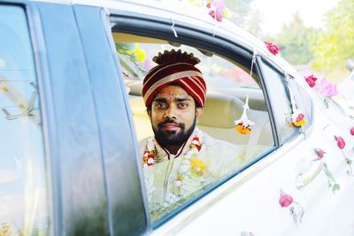 Portrait of young man in car