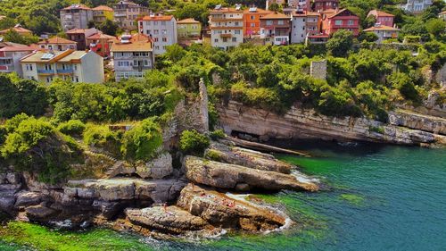 High angle view of townscape by sea