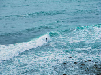 High angle view of people swimming in sea