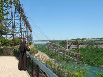 Nun photographing sir adam beck hydroelectric generating stations