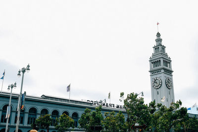 Low angle view of clock tower against sky